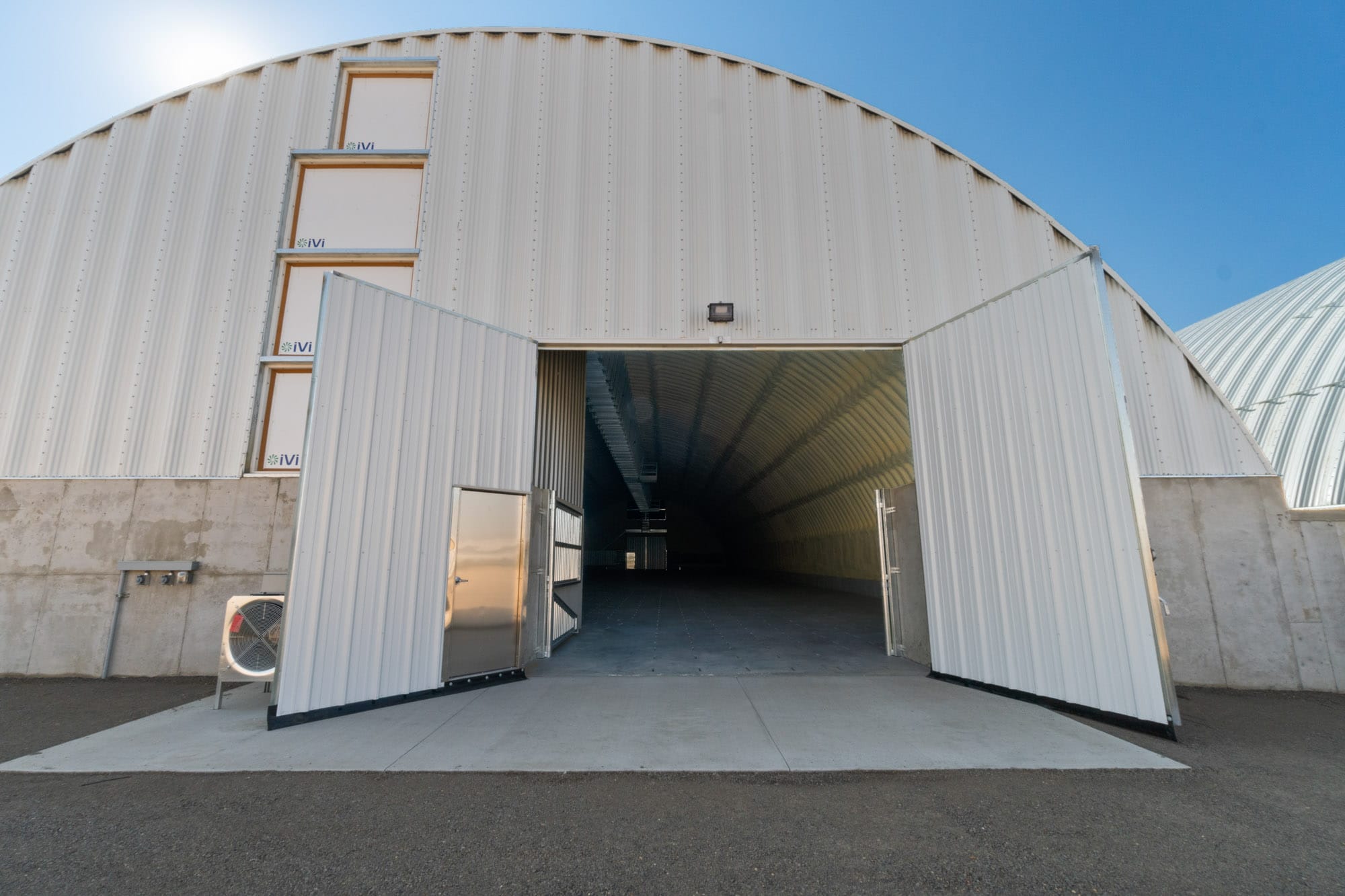 Open entrance to large, empty industrial warehouse
