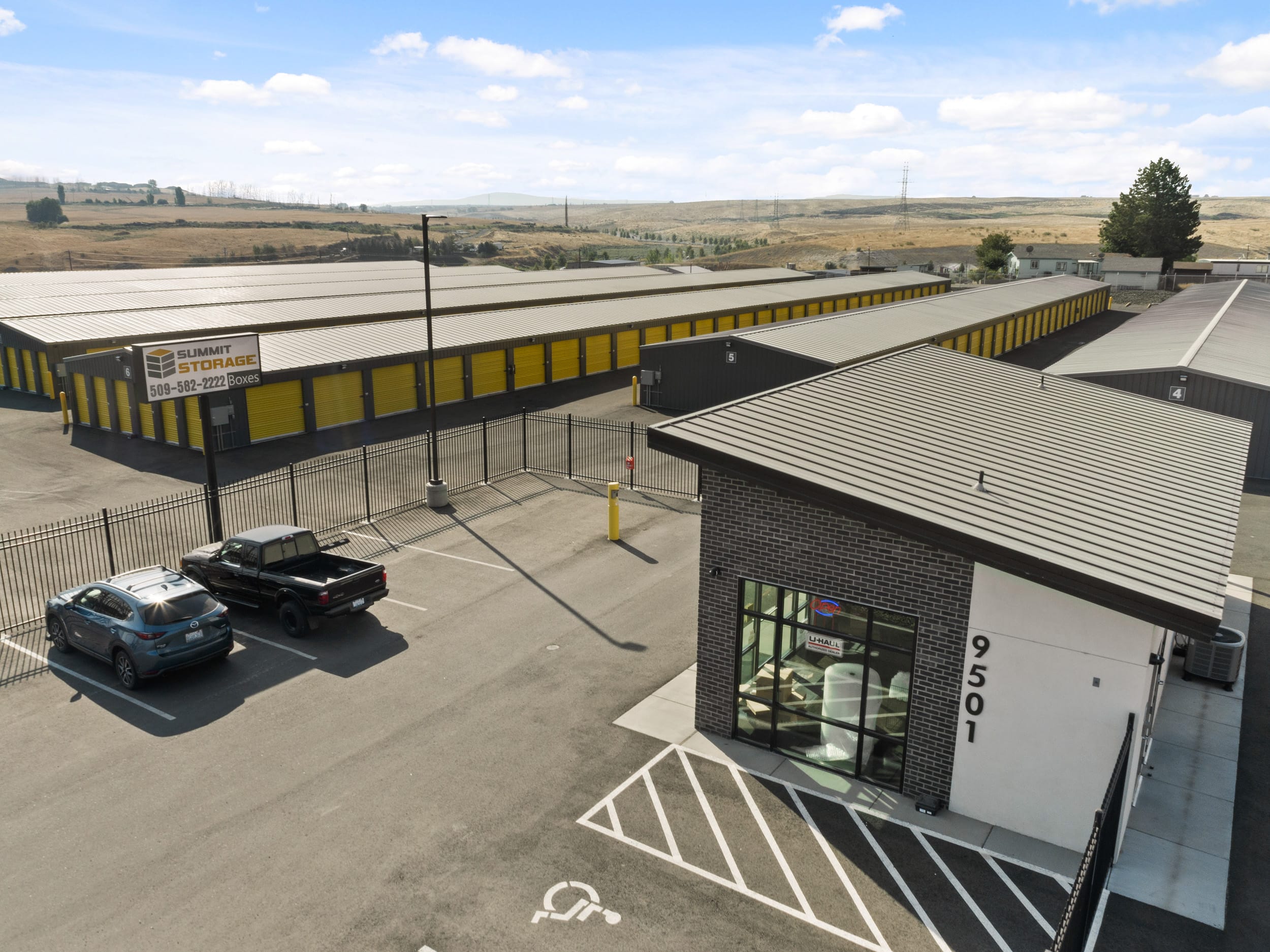 Summit Storage facility with parked vehicles.